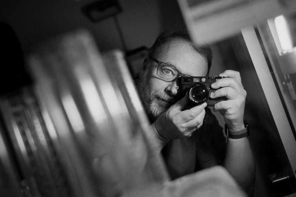 Self-portrait in mirror. Leica M6/50mm Summilux/HP5